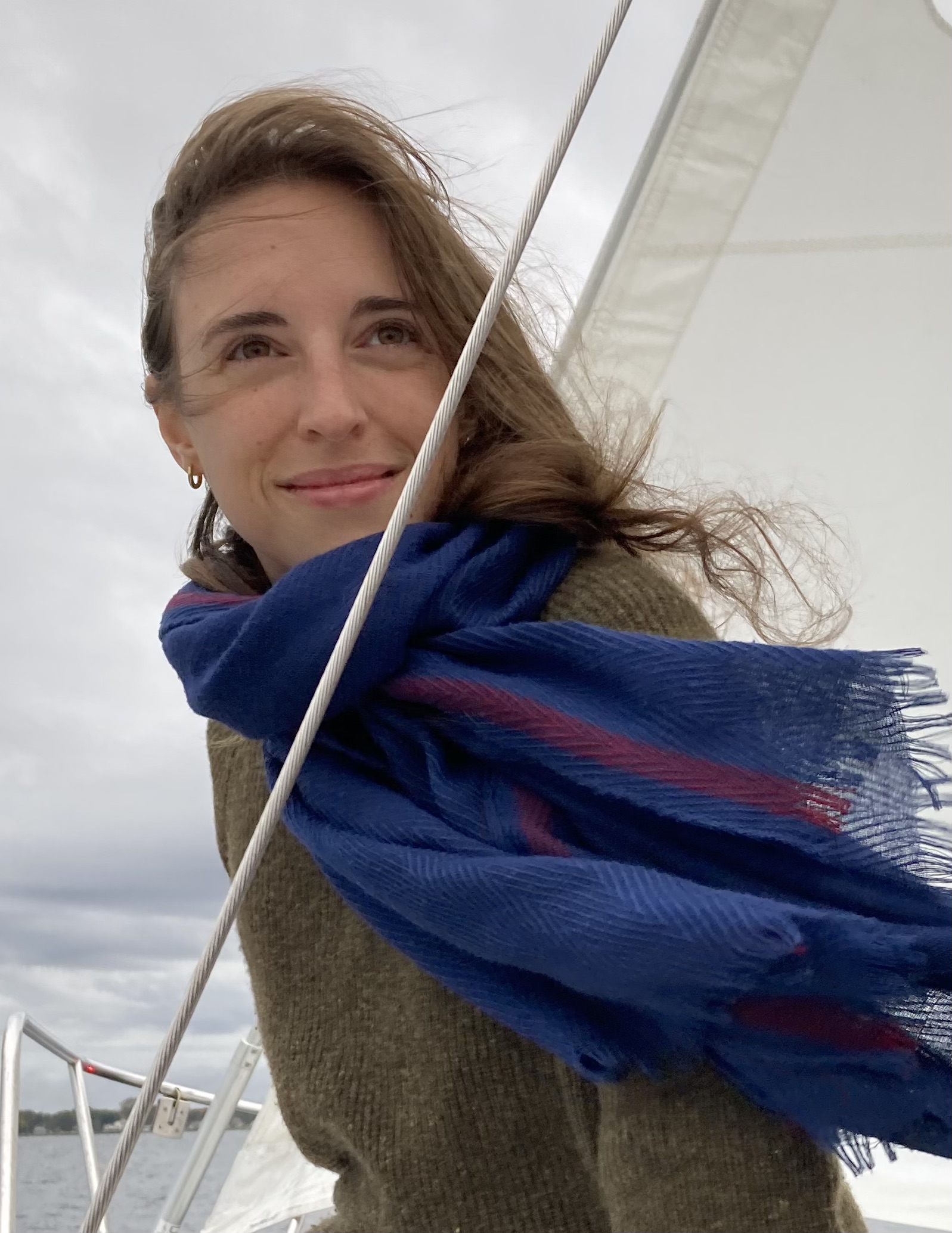 Picture of Anna, a smiling person on a sailboat